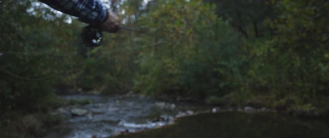 A man casts his fishing line