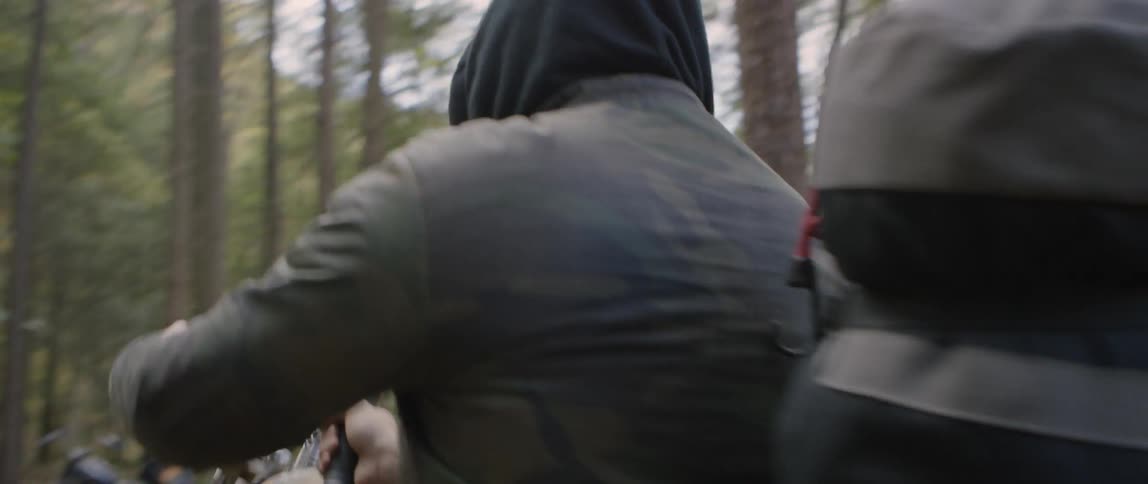 Motorcyclists gather in the woods
