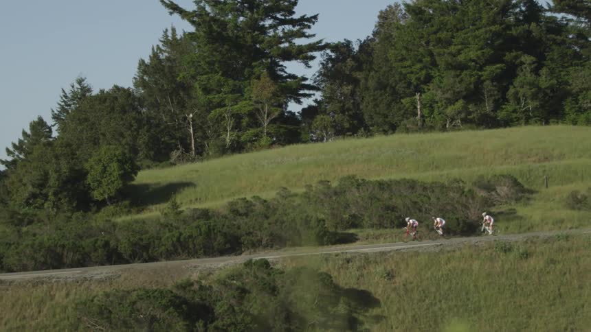 People riding bikes down a trail