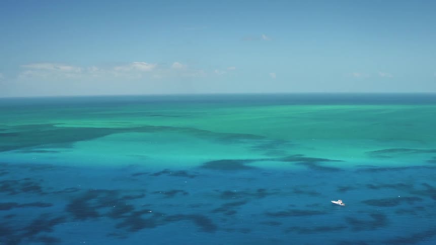 A boat floats on an ocean
