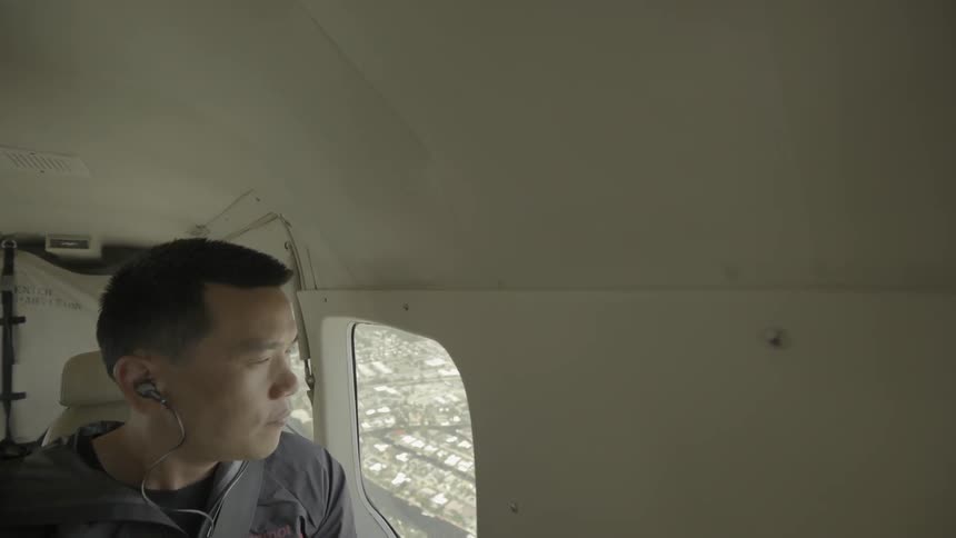 A man rides in a small plane