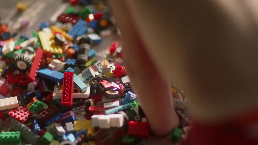 A child plays with toy building blocks