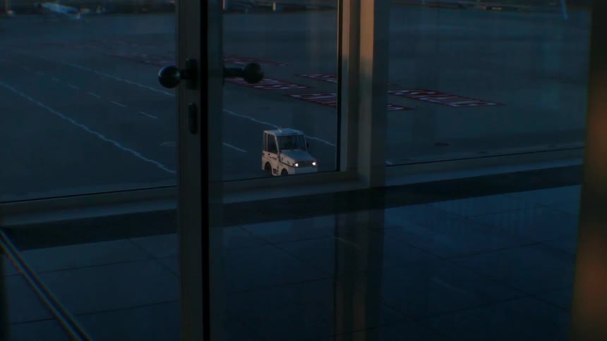 Cart moving along a path at an airport