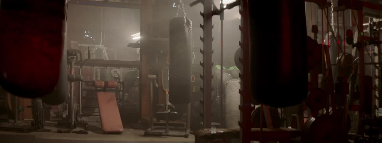 Lights turn on in a gym with a punching bag