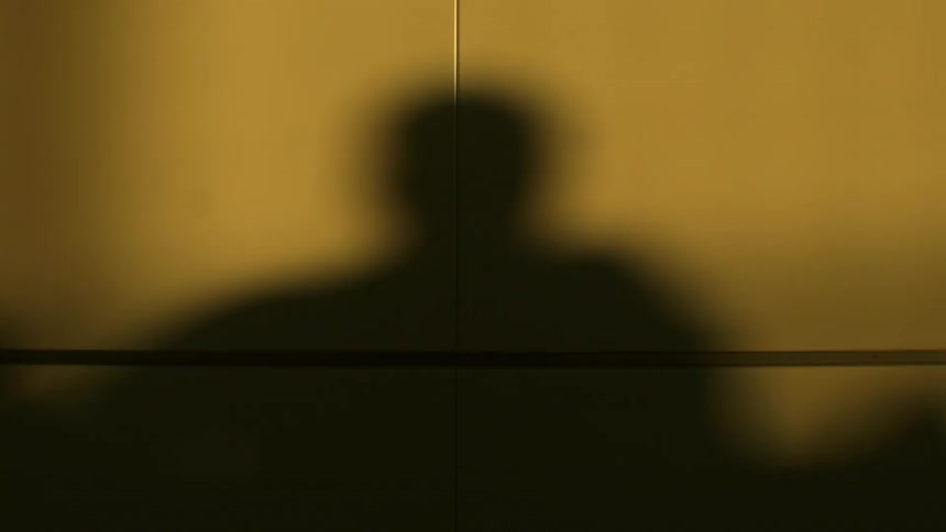 Peoples' shadows on a wall