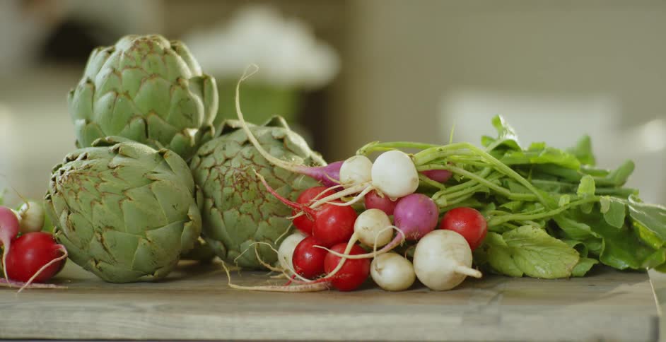 The cutting board is covered with vegetables
