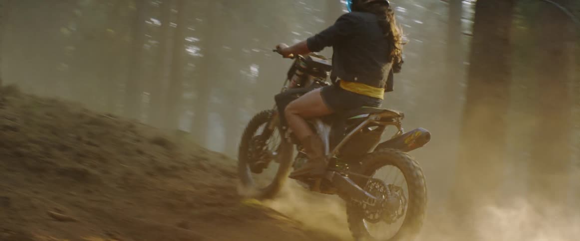 A dirt bike jumps off a huge jump