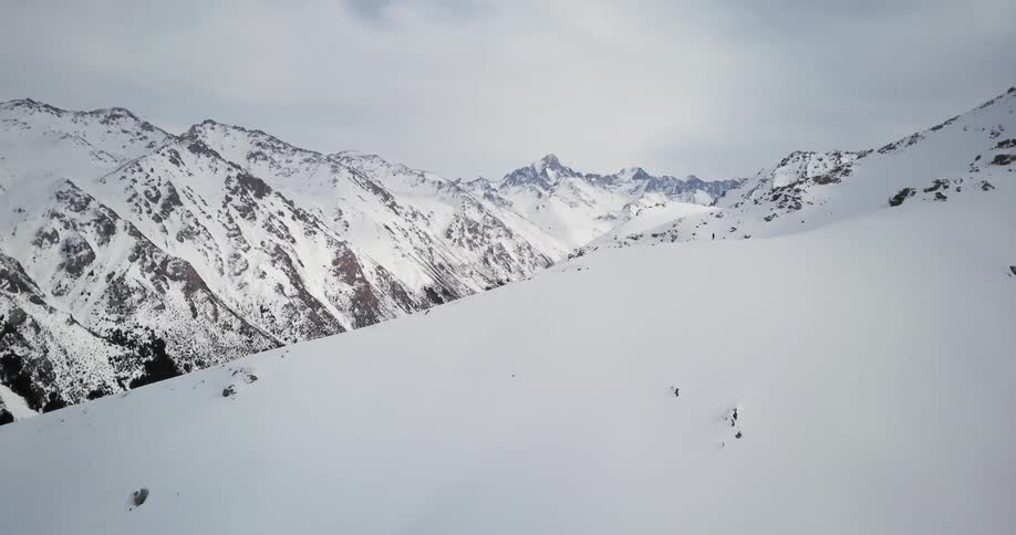 Snow covers a mountain ridge
