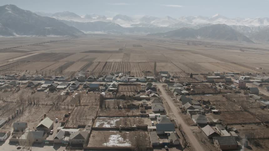 A neighborhood sits near mountains