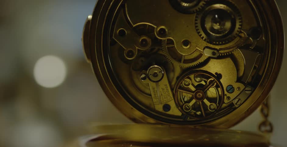 A pocket watches gears are spinning