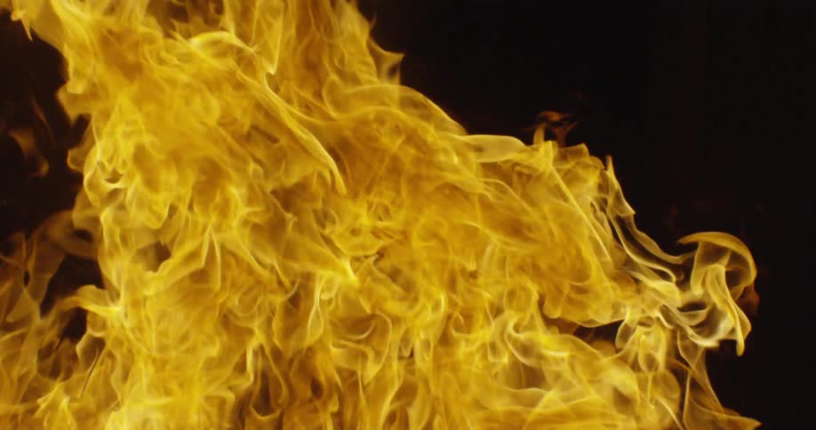 Flames from a fire are burning at night