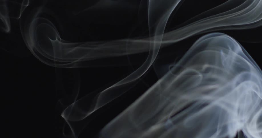 Curls and wisps of smoke are rising up into the air