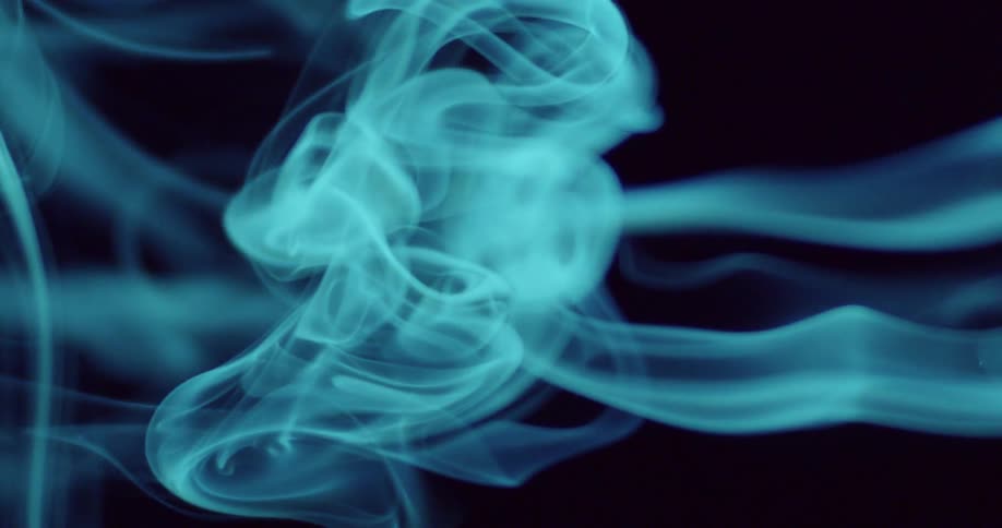 Blue smoke bellows into the air
