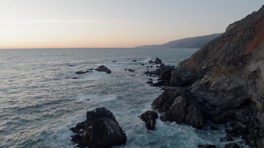 Waves flow into the rocky shore
