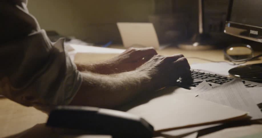 A man types on a keyboard
