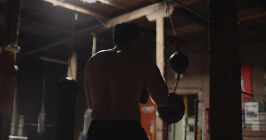 A boxer trains on a speed bag