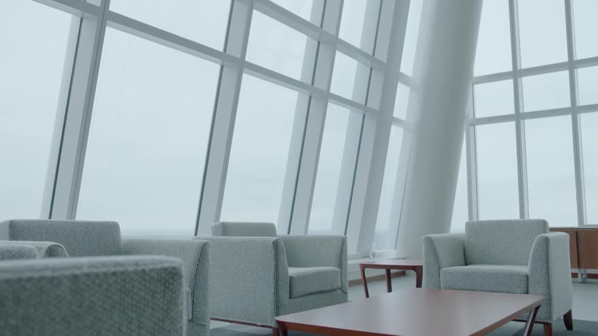 The large room is surrounded by windows
