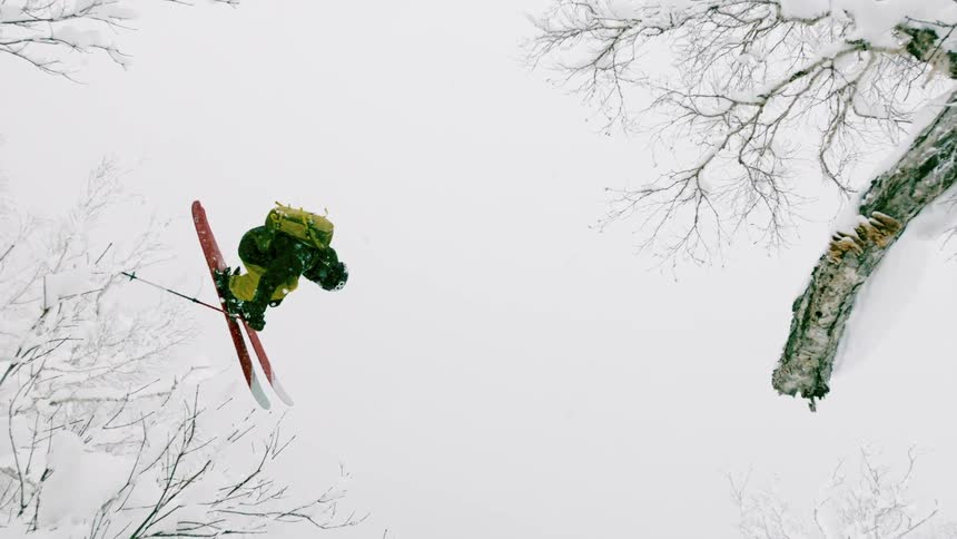 A skier flies through the air