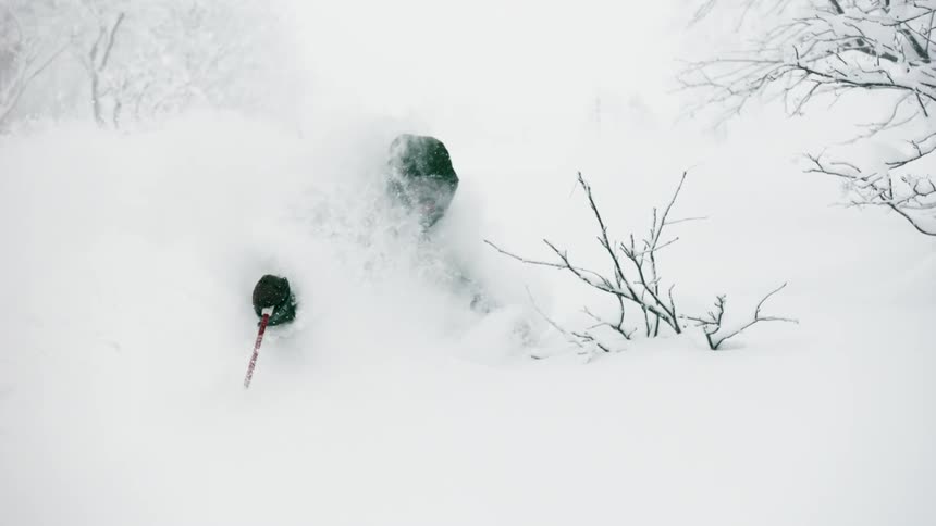 Person turns through deep snow