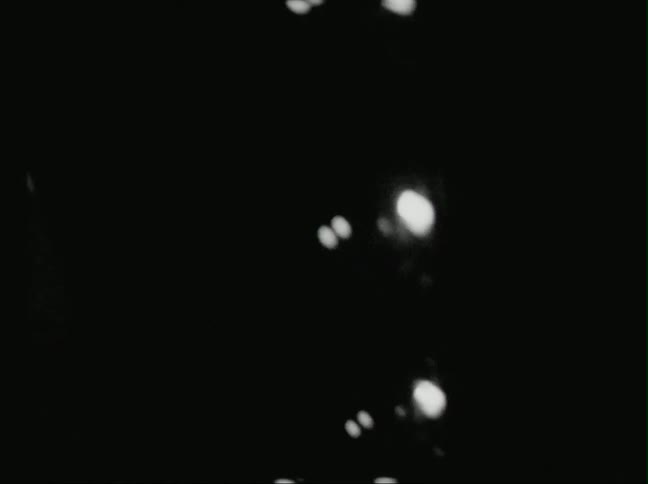Lights are flashing in a very dark area