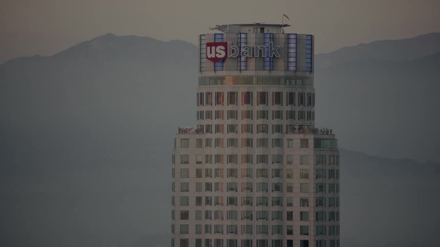 Skyscrapers in a city at sunset