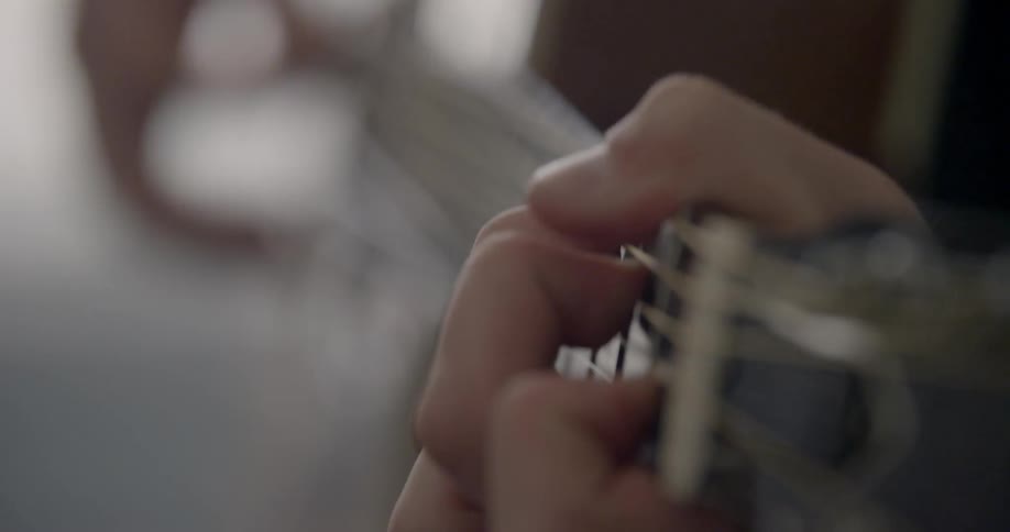 A man plays a guitar