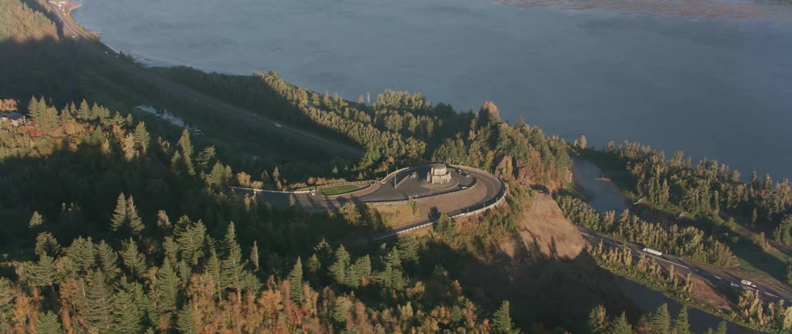 A vehicle travels on a mountain road