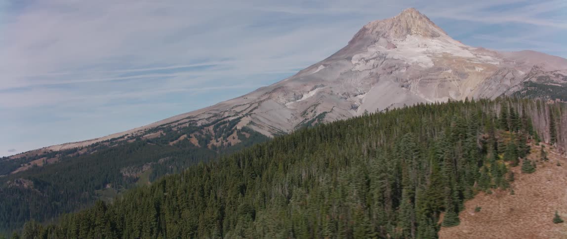 Trees cover the mountainous landscape