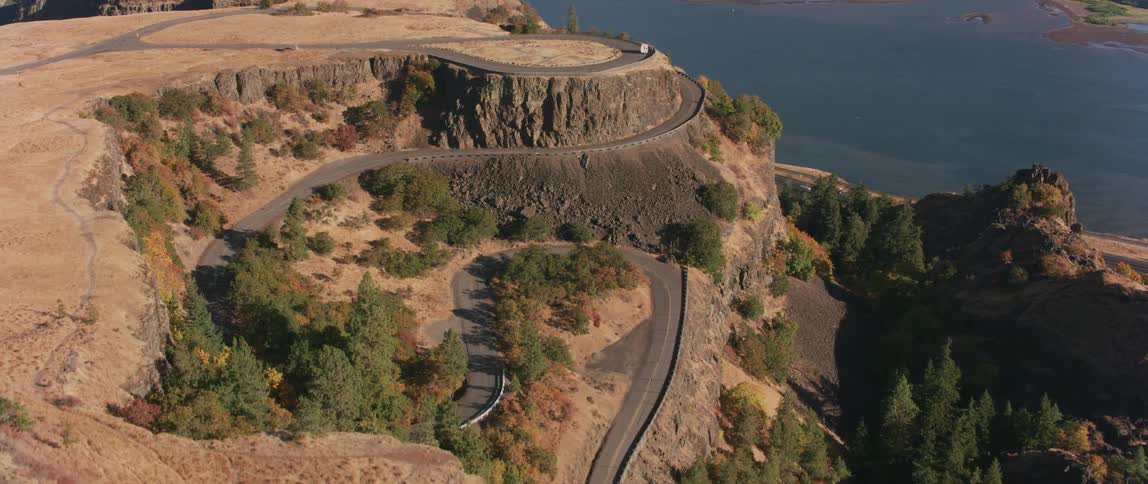 A road winds up a mountainside