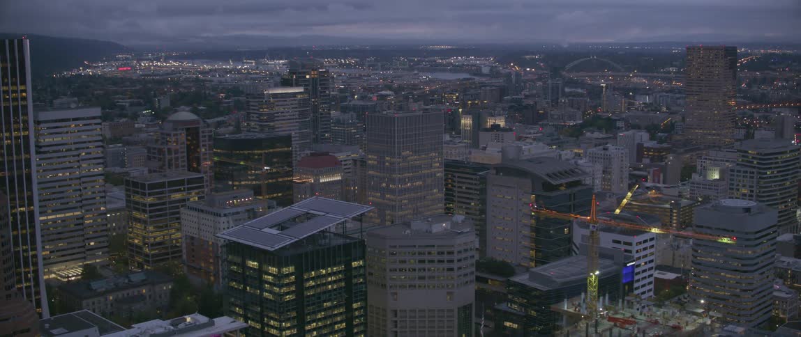 Many skyscrapers light up at dusk