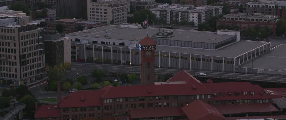 Train station lights flash on a tower