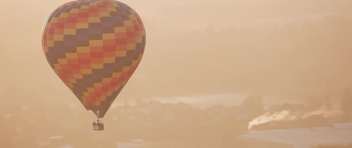 A hot air balloon floats in the sky