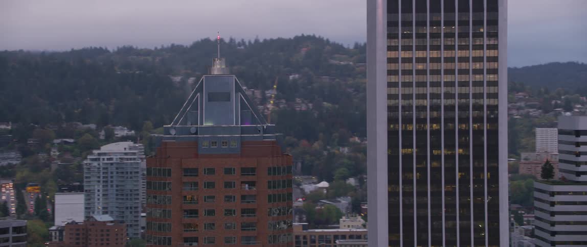 A crane stands above a construction site in a city