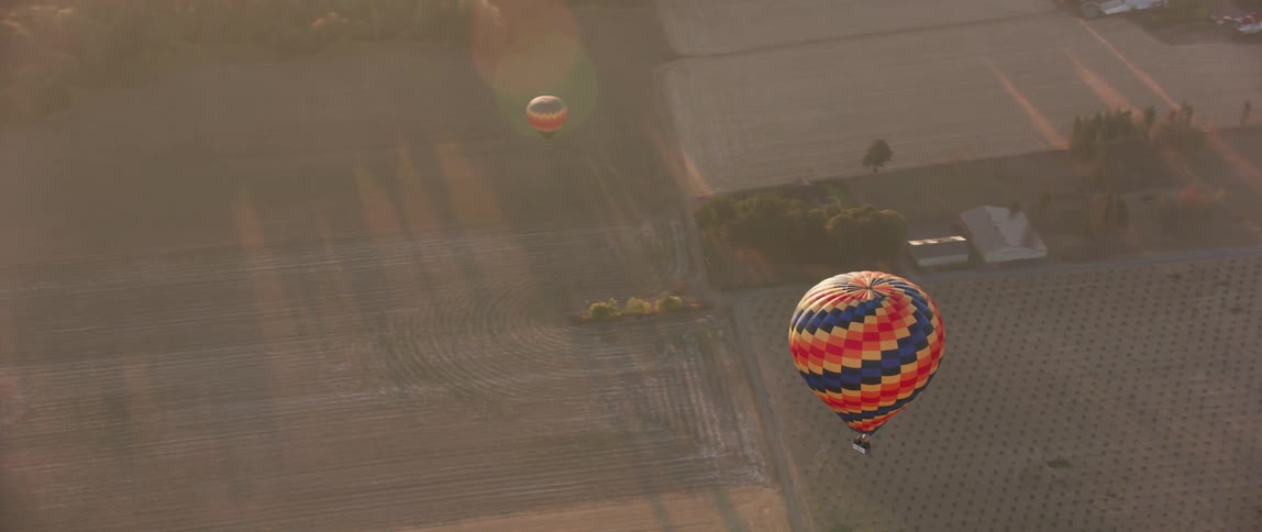 A hot air balloon floats in the sky