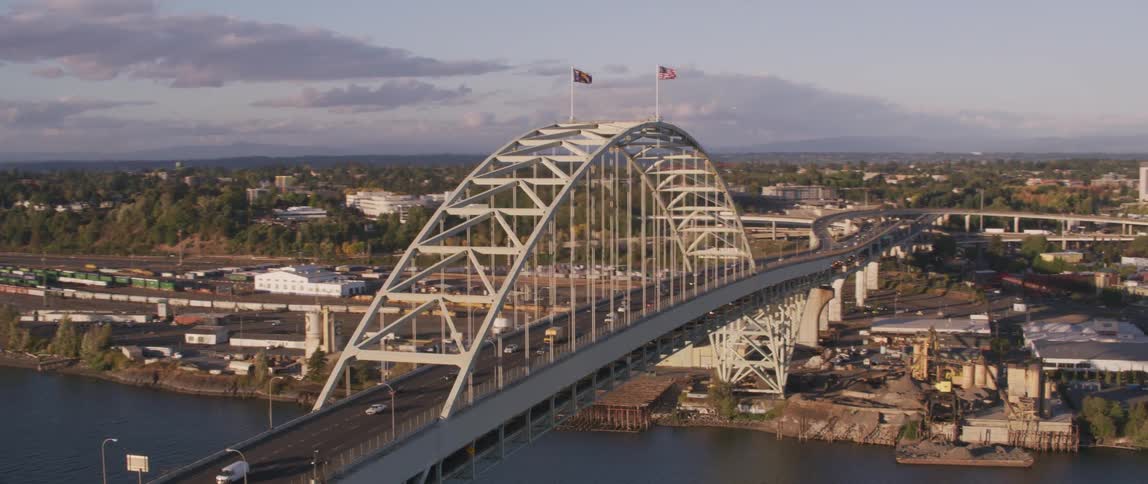 Large bridge over a river surrounded by buildings