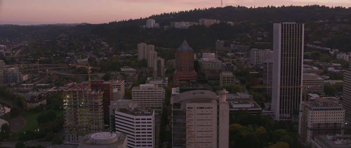 Tall city buildings tower into the sky
