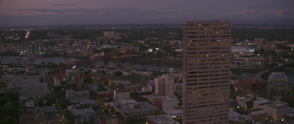 A tall city building towers into the sky