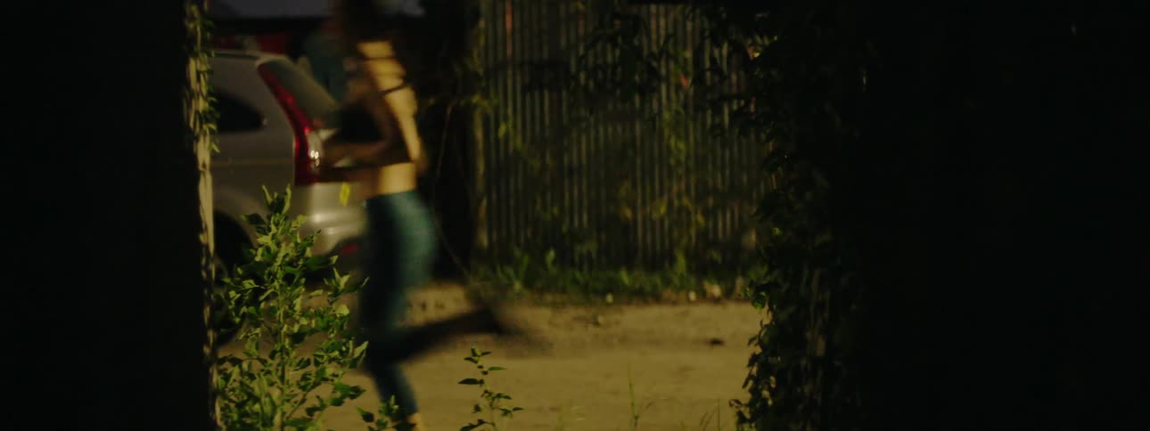 A woman jogs down the street