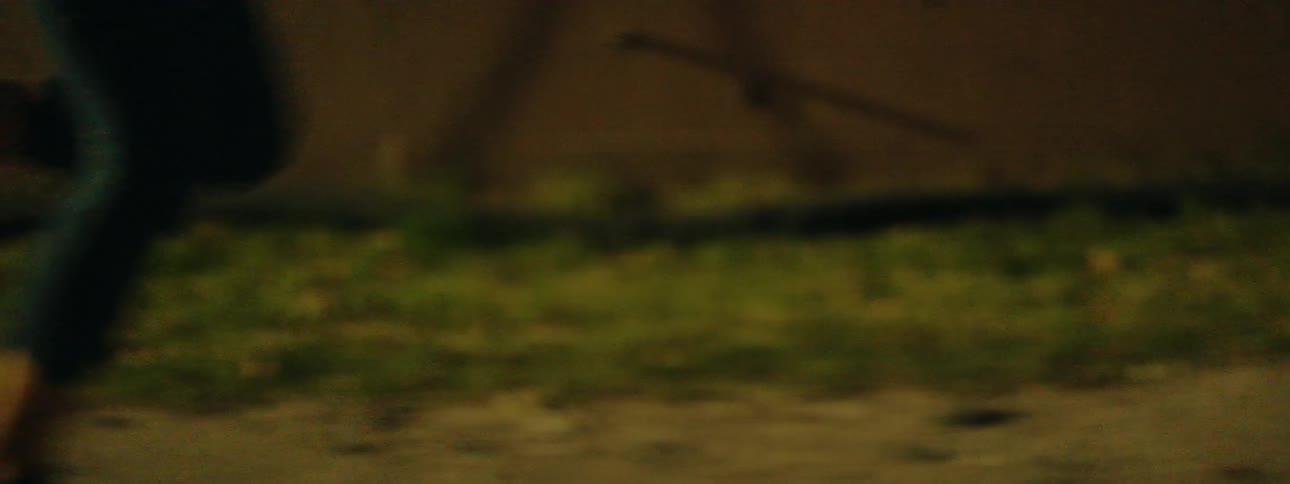 Woman runs outside at night