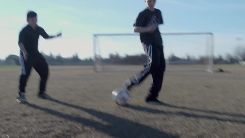 Kids play soccer on the field