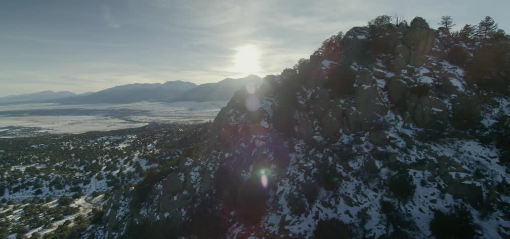 Snowy mountains on a cloudy sunset