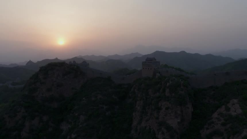 The great wall of china along ridges at sunset