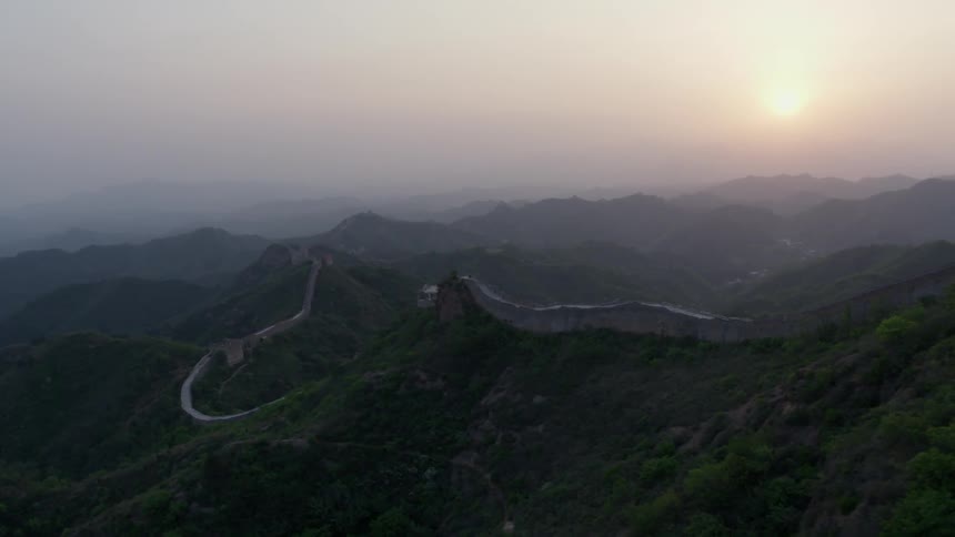 Haze is lingering in the air over the great wall of china at dusk