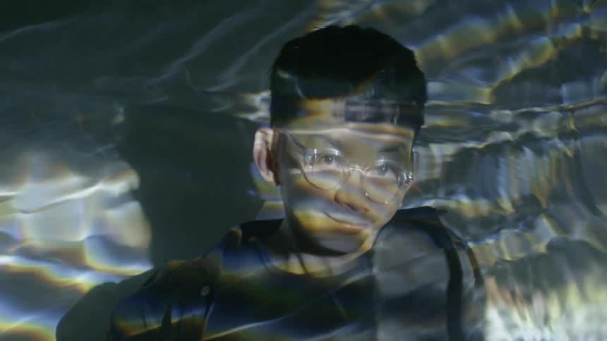 Water reflecting over a man
