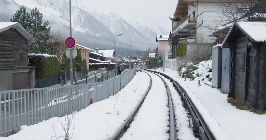 Train tracks in an alpine village in winter