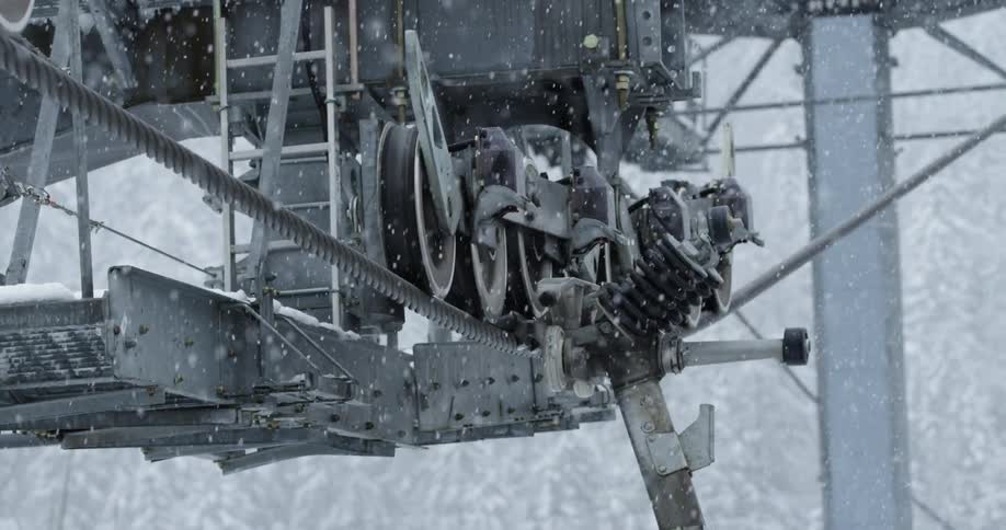 Thick gondola cables on a snowy day