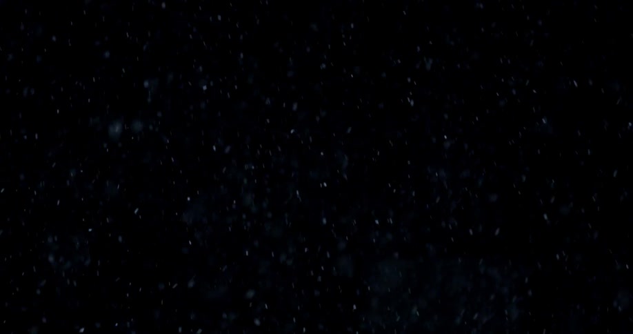 Snow falling at night