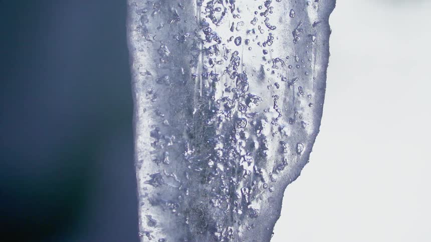 The hanging ice has bubbles inside