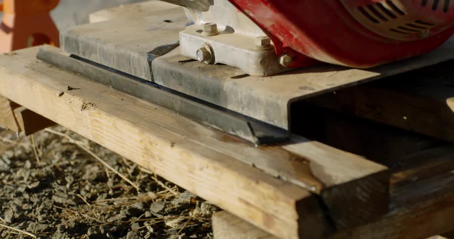 The wood is stacked with metal on top