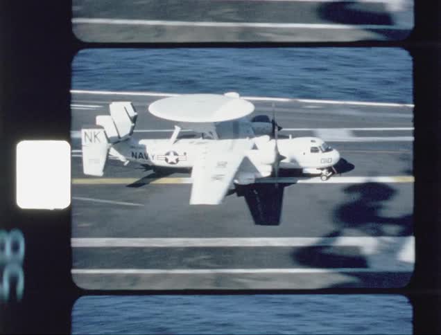 A plane lands on the hangar moving to the edge